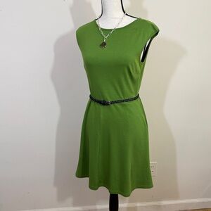 New York & Co knit dress in a shade of green. Sleeveless, pockets fit and flair